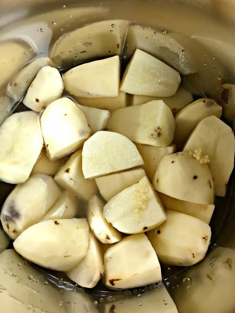sliced potatoes in an instant pot with water
