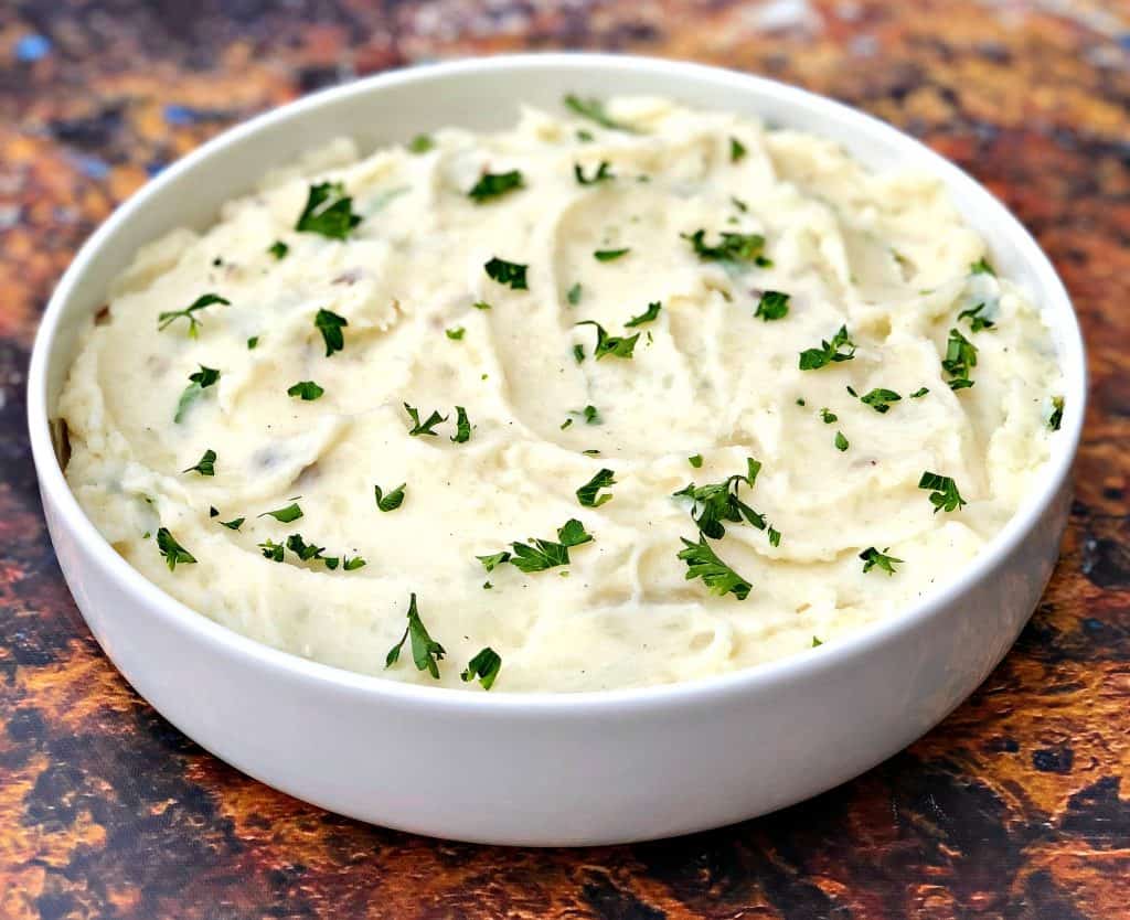 instant pot mashed potatoes in a white bowl