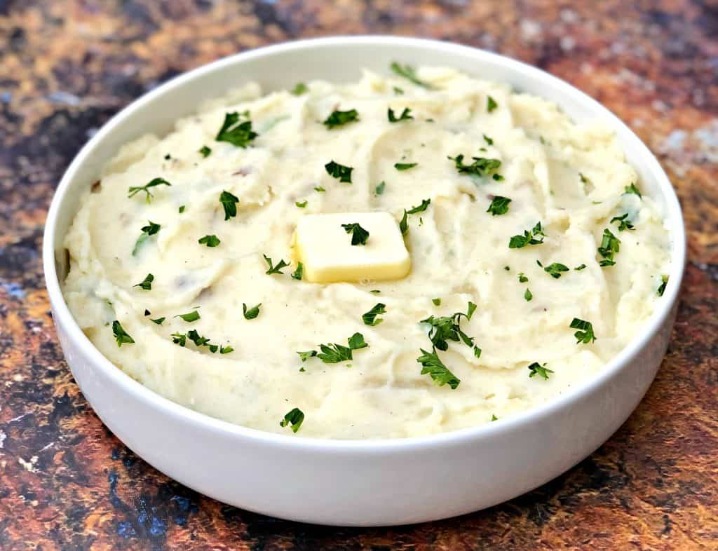 instant pot mashed potatoes in a white bowl