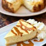 keto cheesecake low carb on a white plate with caramel and whipped cream