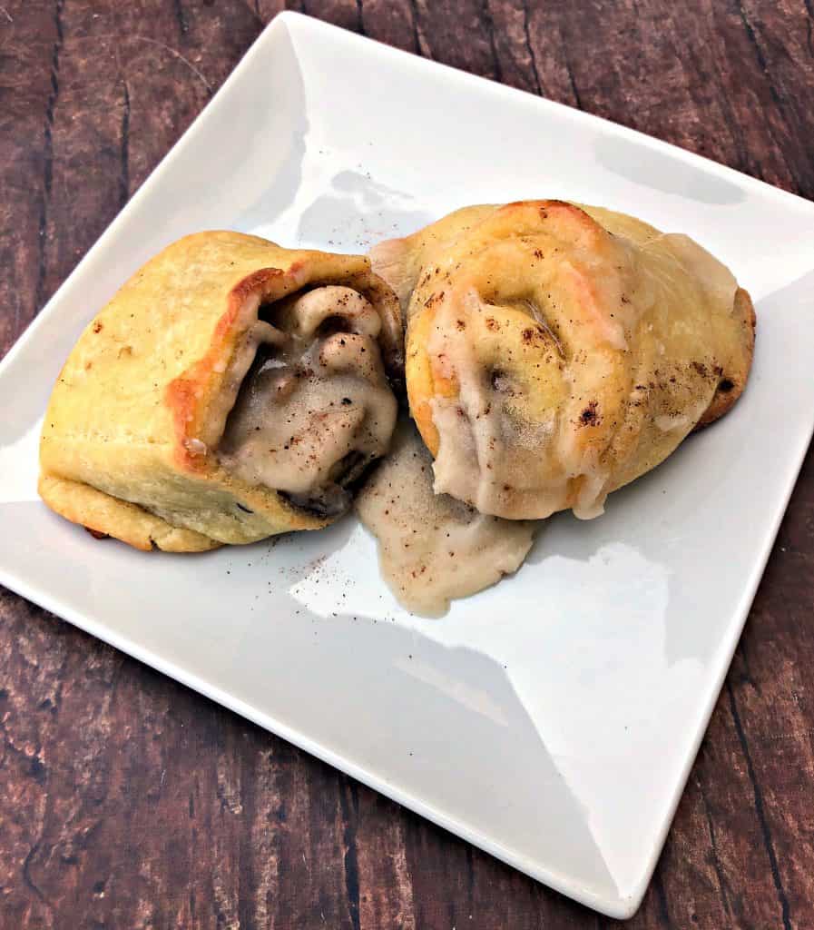 keto fathead cinnamon rolls on a white plate