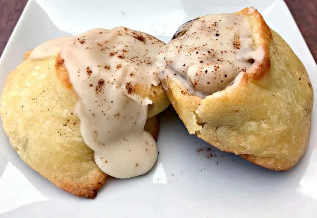 keto fathead cinnamon rolls on a white plate