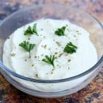 keto low carb cauliflower mashed potatoes in a glass bowl.