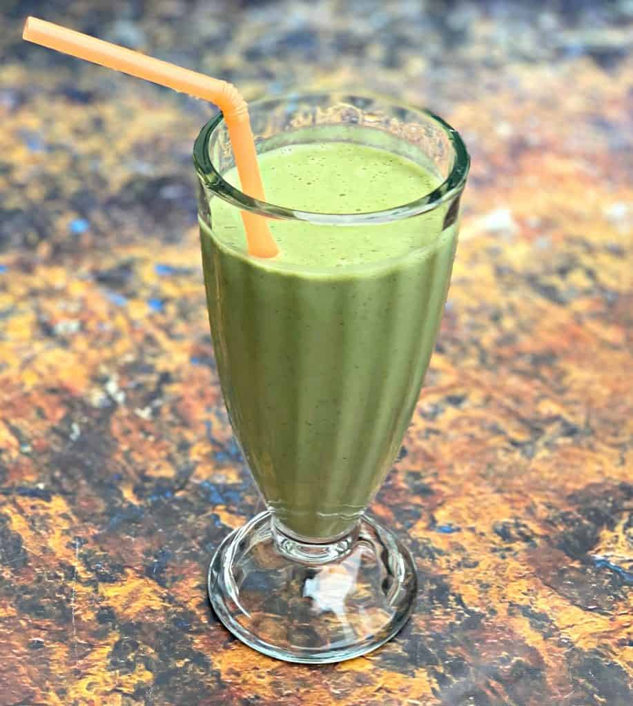 instant pot blender smoothie in a glass with a straw