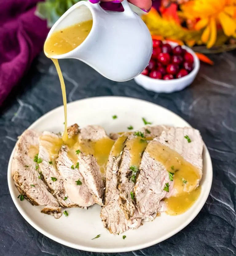 intstant pot turkey breasts with gravy on a white plate