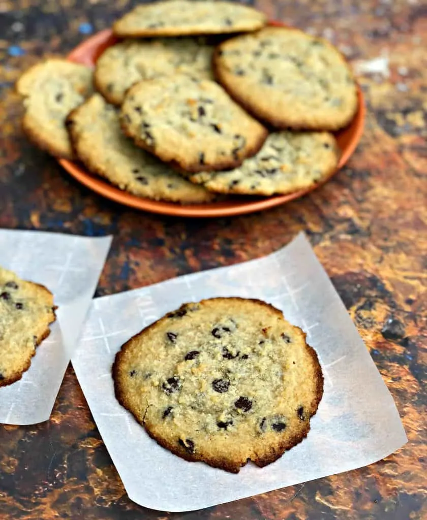 keto chocolate chip cookies on a plate with a glass of milk