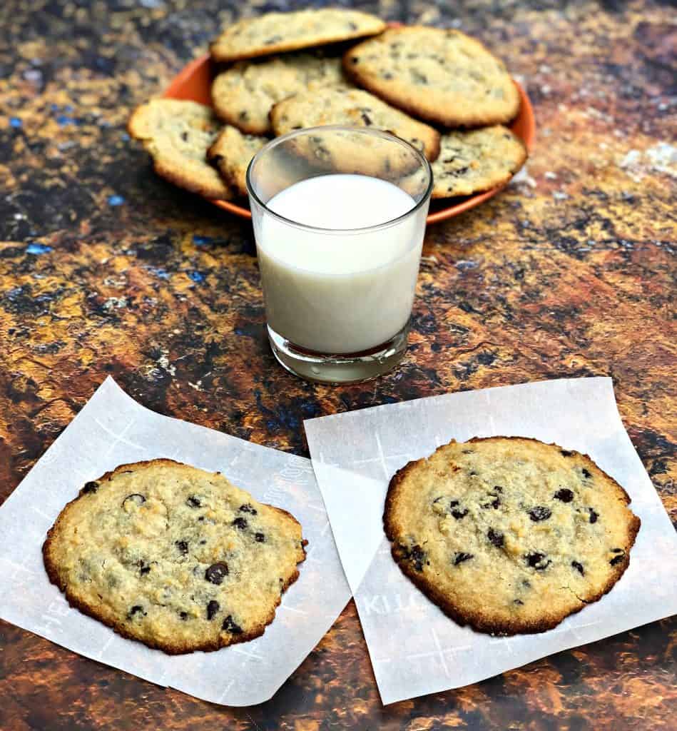 keto chocolate chip cookies on a plate with a glass of milk