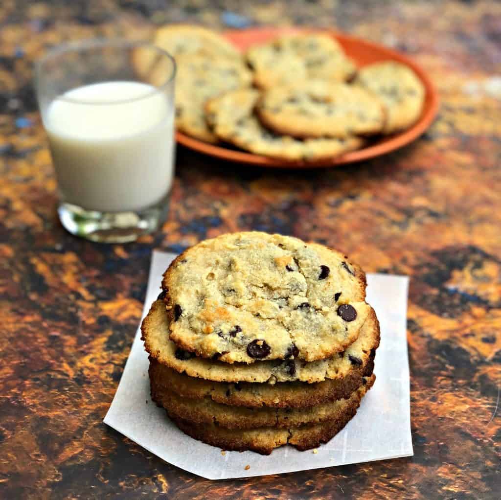 keto chocolate chip cookies on a plate with a glass of milk