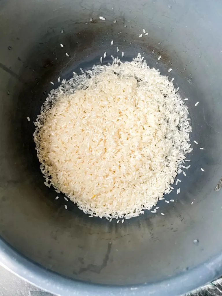 instant pot red beans and rice in a white bowl with French bread