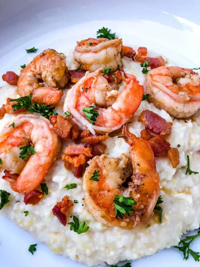 shrimp and grits on a white plate