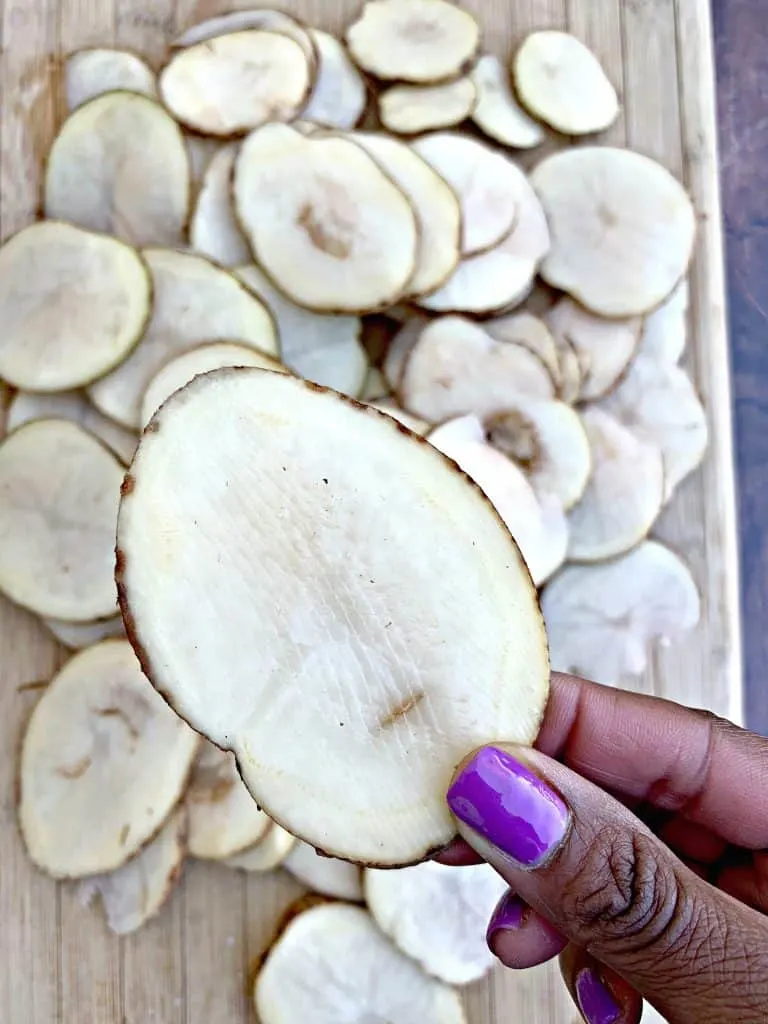 sliced potatoes on cutting board