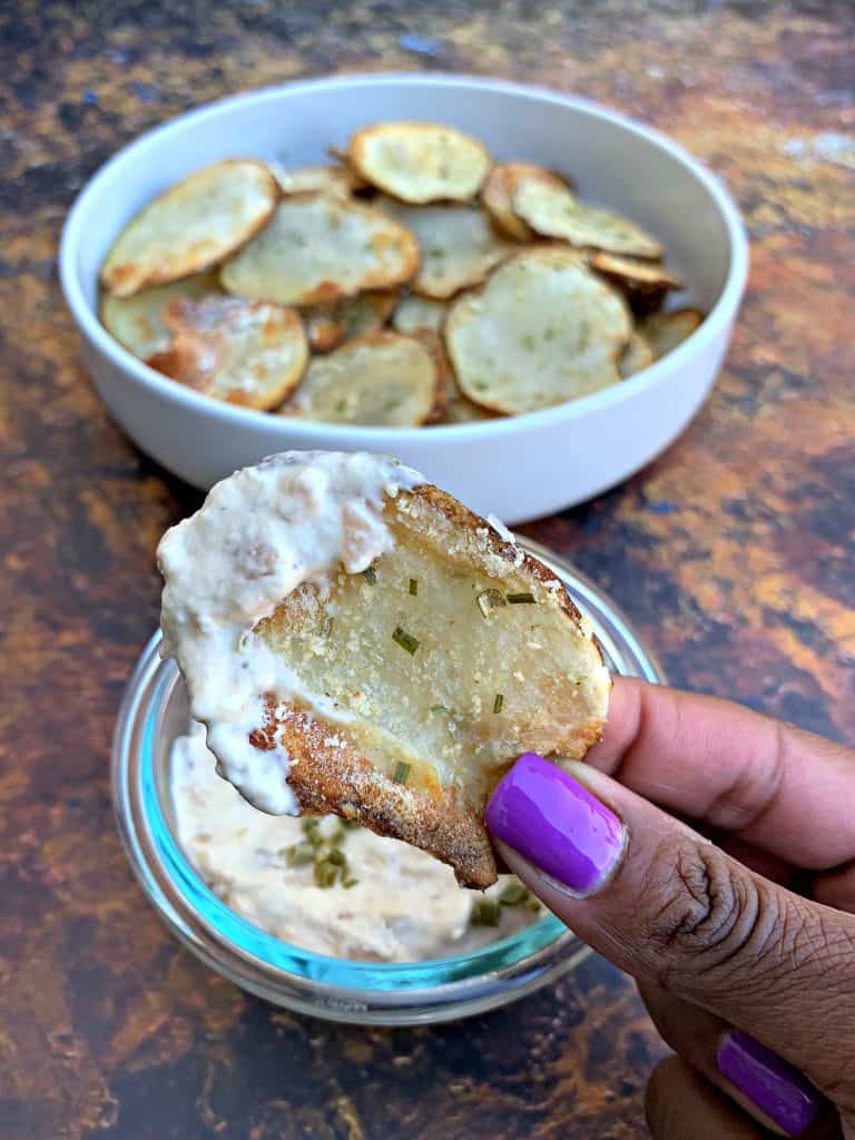 air fryer potato chips in a white bowl with dip