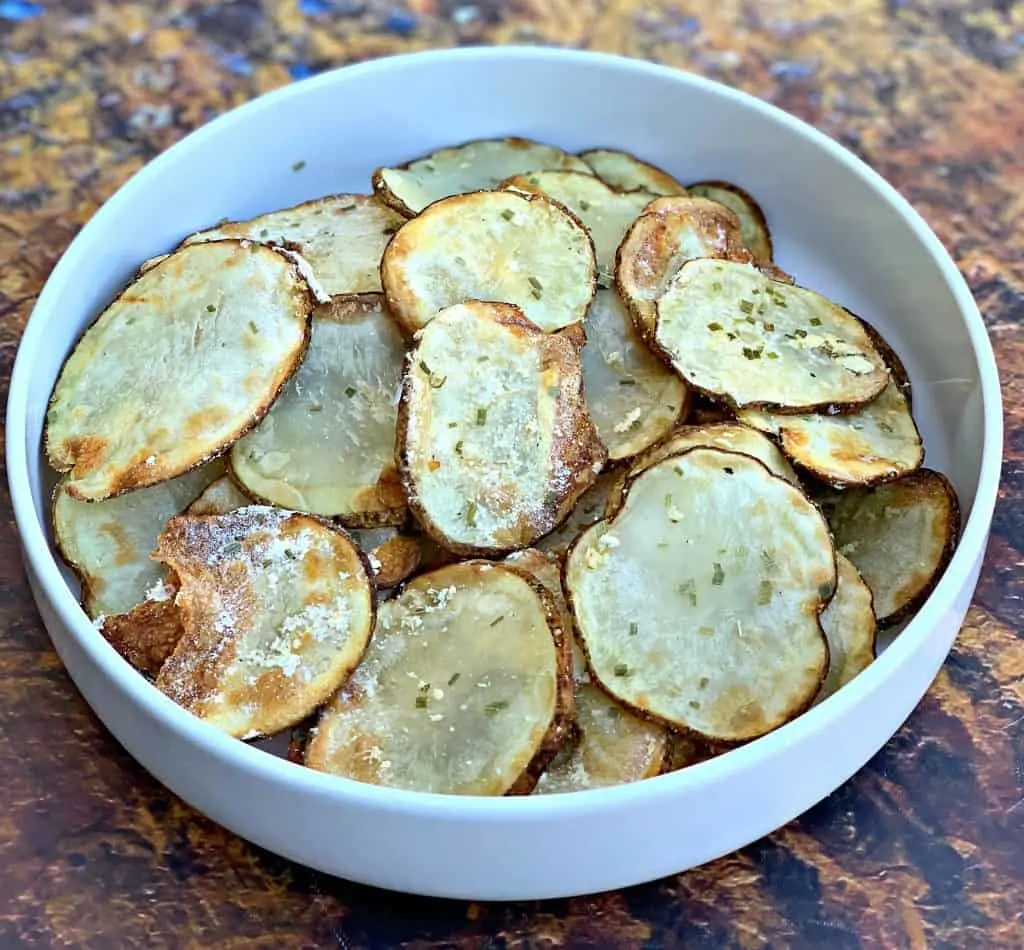 air fryer potato chips in a white bowl