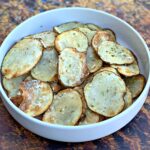 air fryer potato chips in a white bowl