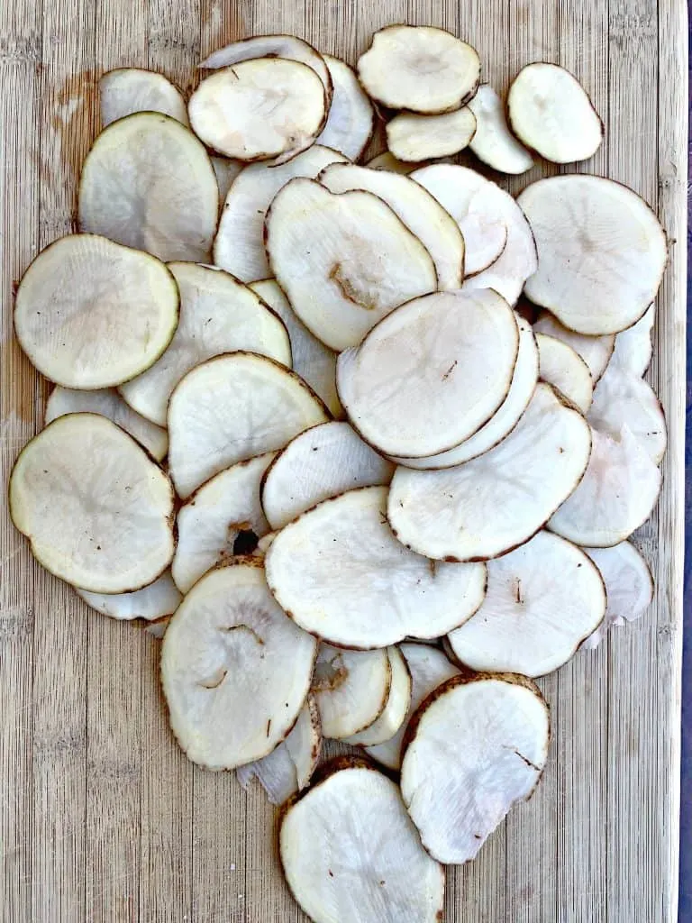 sliced potatoes on a cutting board