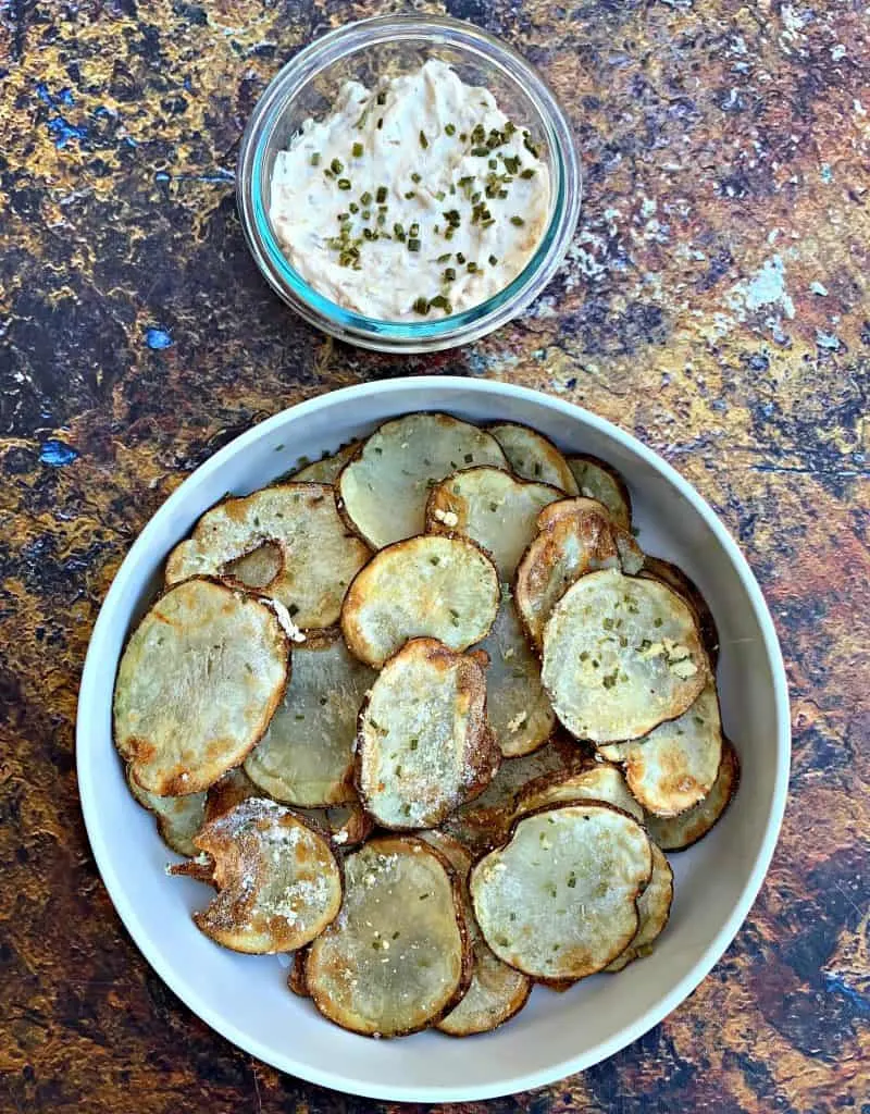 air fryer potato chips in a white bowl with dip