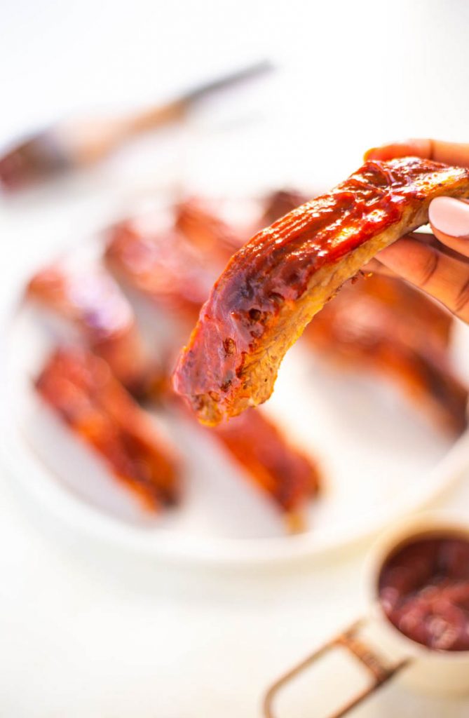 person holding air fryer ribs