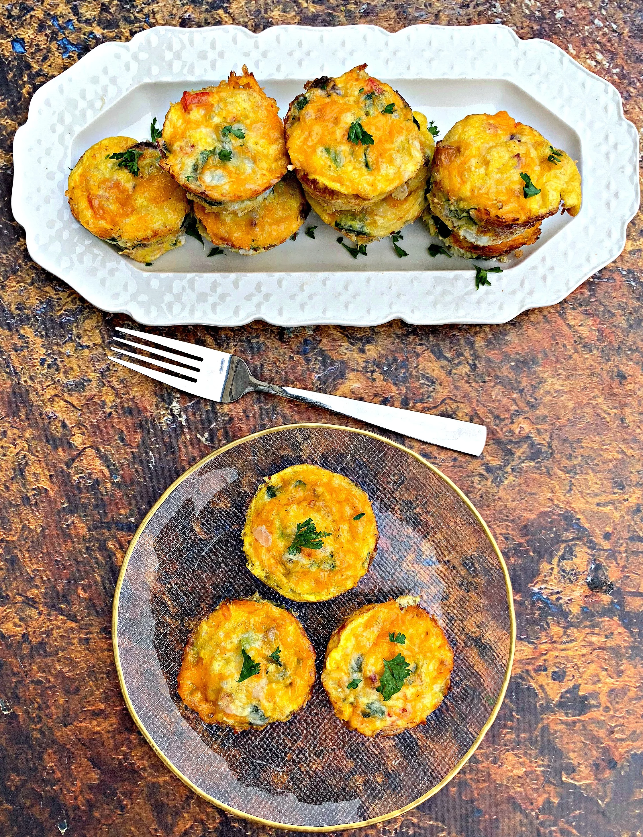 keto bacon egg bites on a white and clear plate