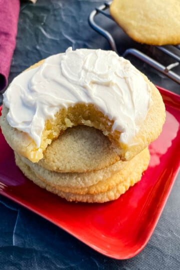 keto low carb sugar cookies on a plate with cream cheese icing
