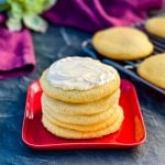 keto low carb sugar cookies on a red plate with cream cheese frosting