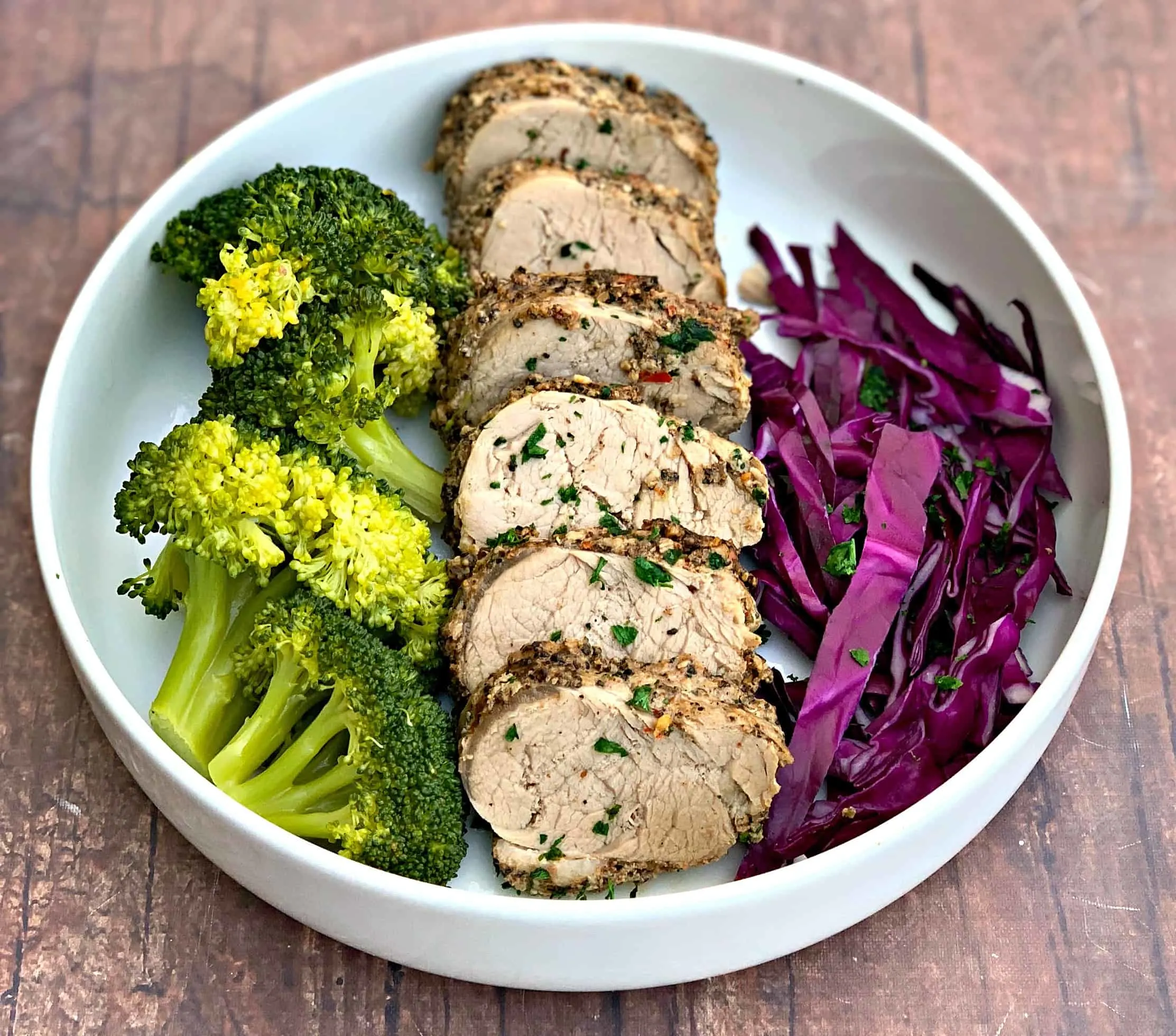 pork loin in a bowl with broccoli
