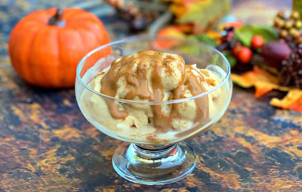 instant pot cooking blender pumpkin spice ice cream in a glass bowl with caramel