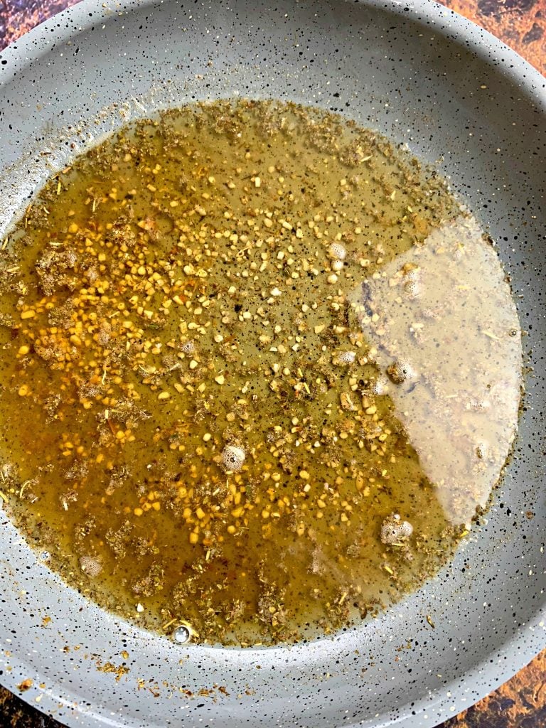 shrimp scampi sauce in a pan