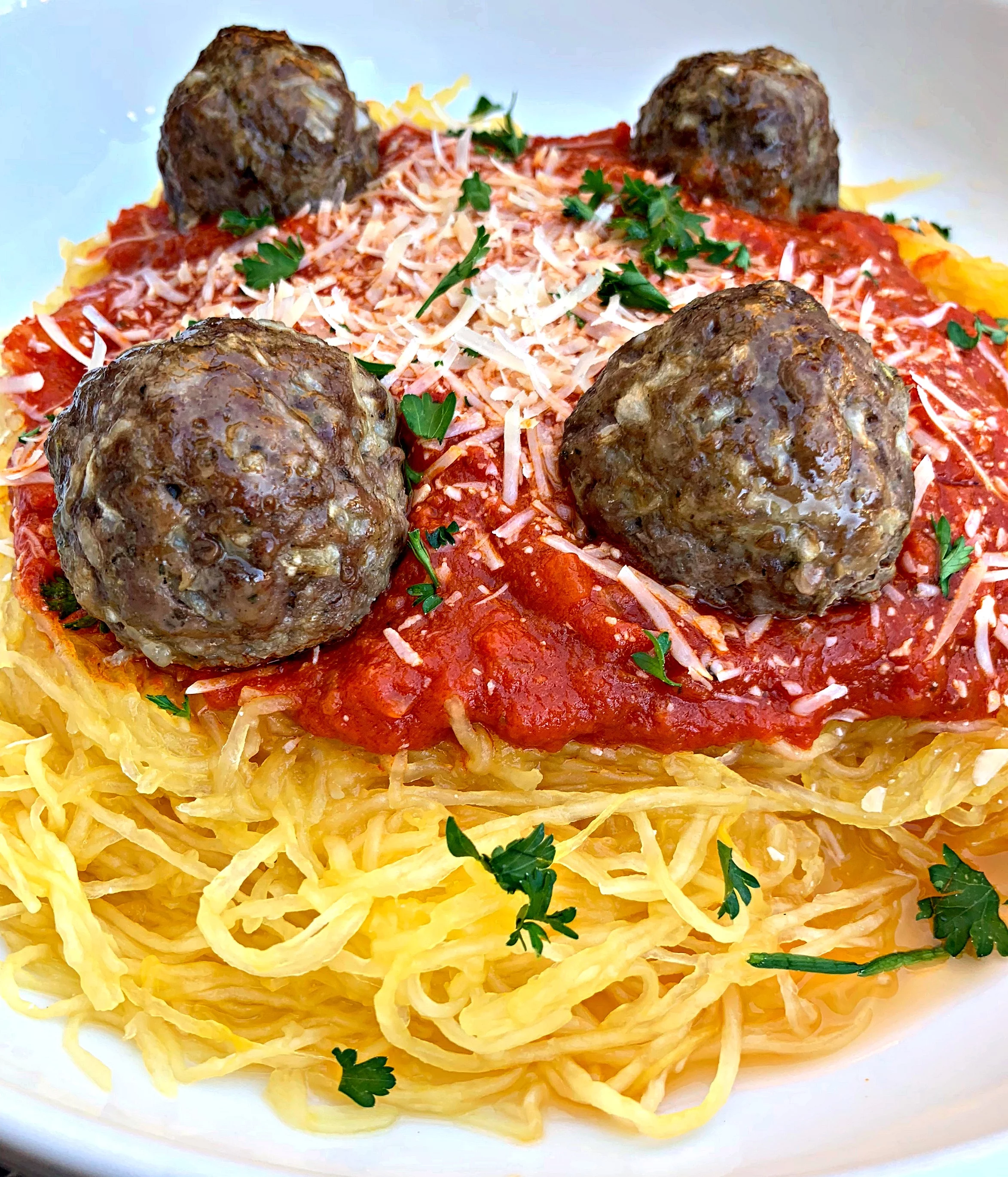 spaghetti squash marinara in a white bowl