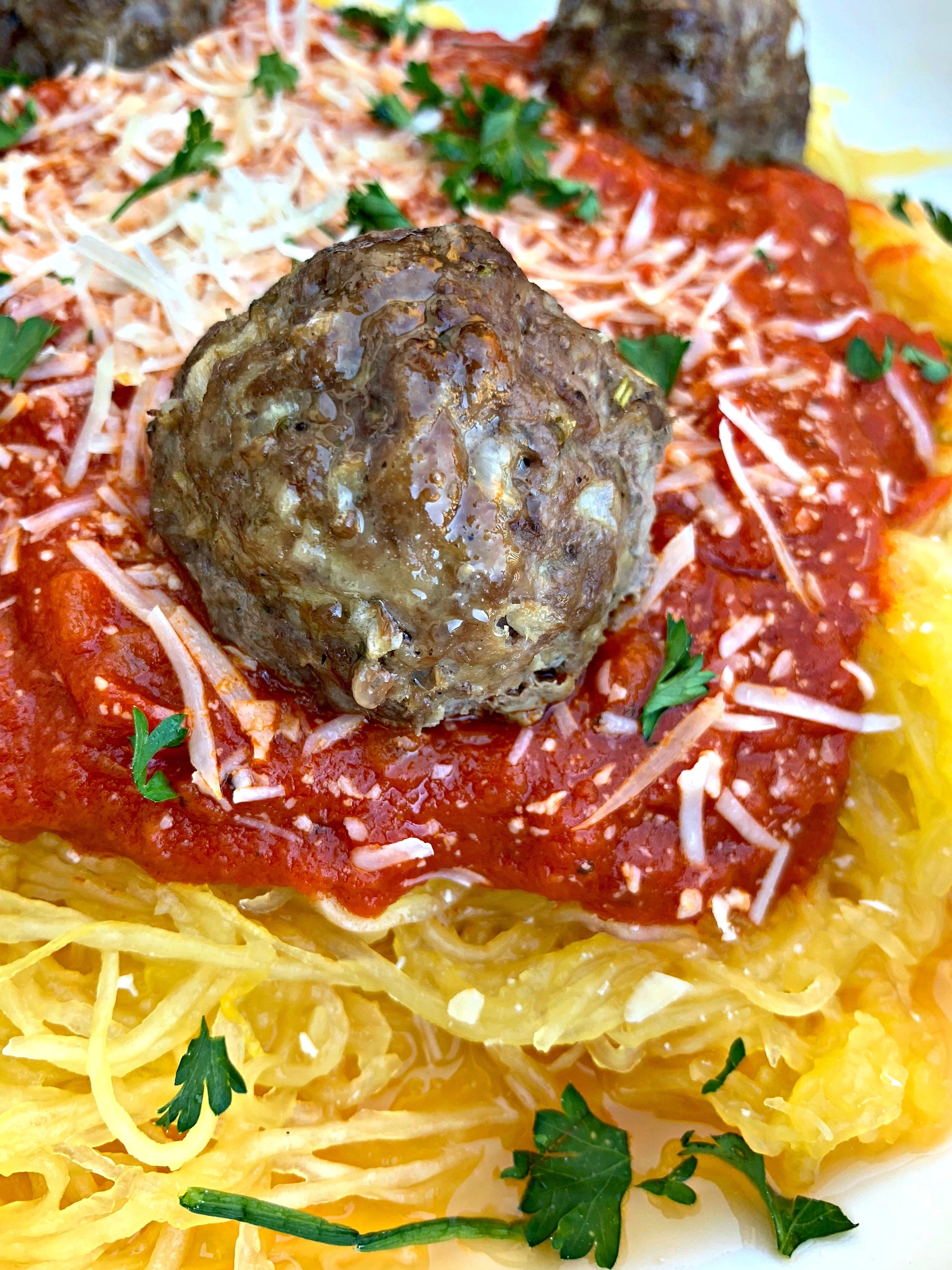 spaghetti squash marinara in a white bowl