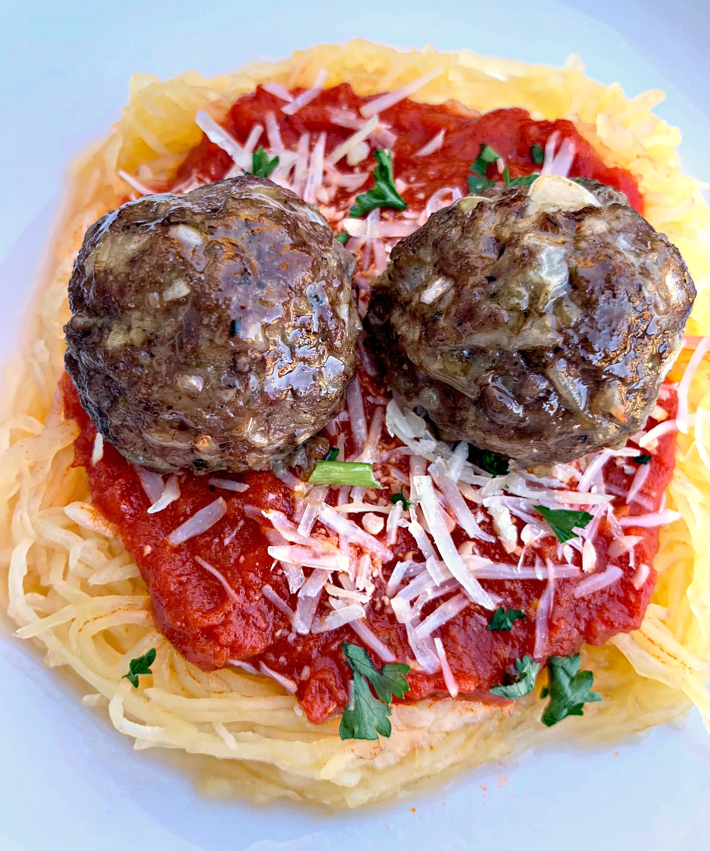 spaghetti squash marinara in a white bowl