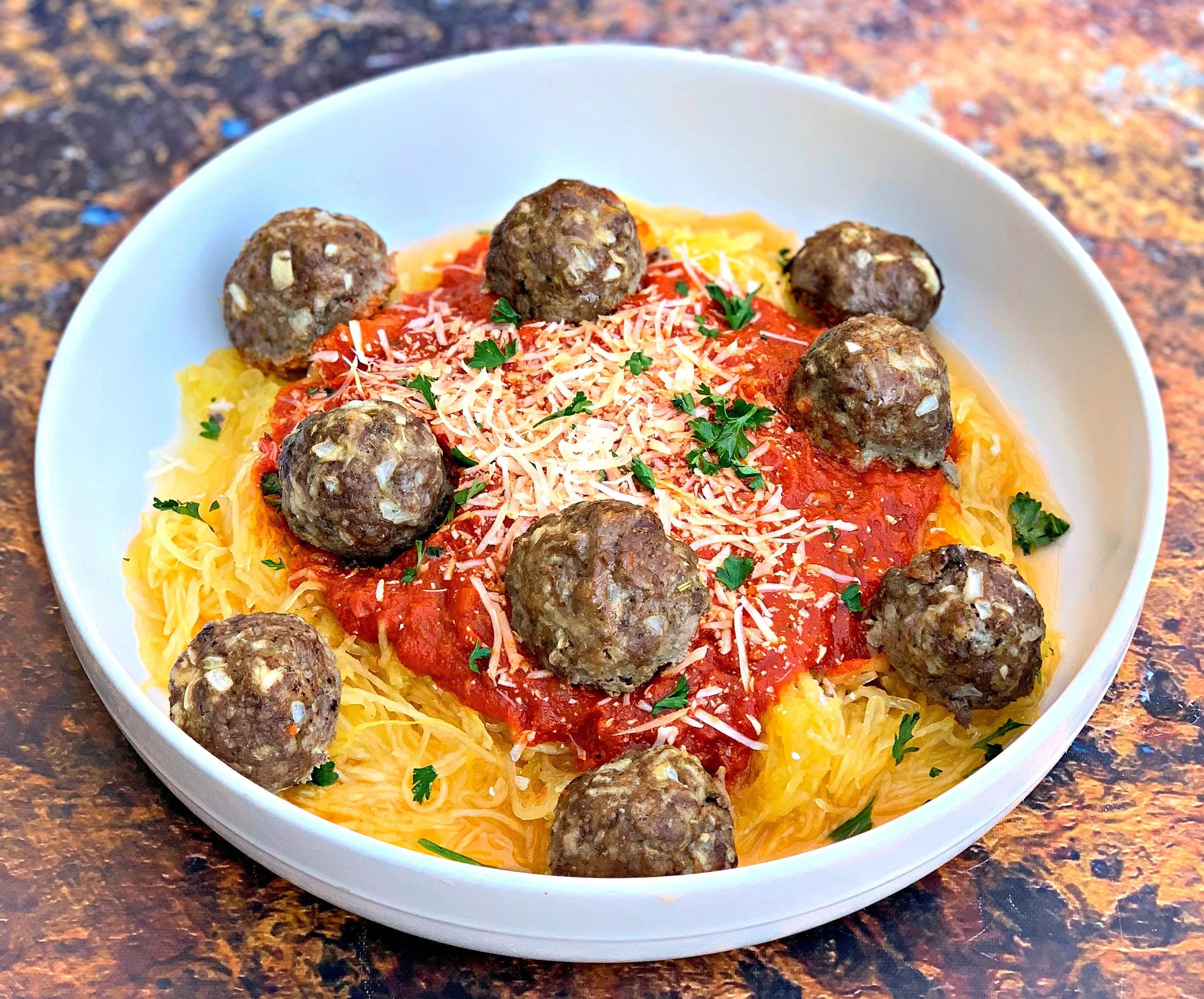 spaghetti squash marinara in a white bowl