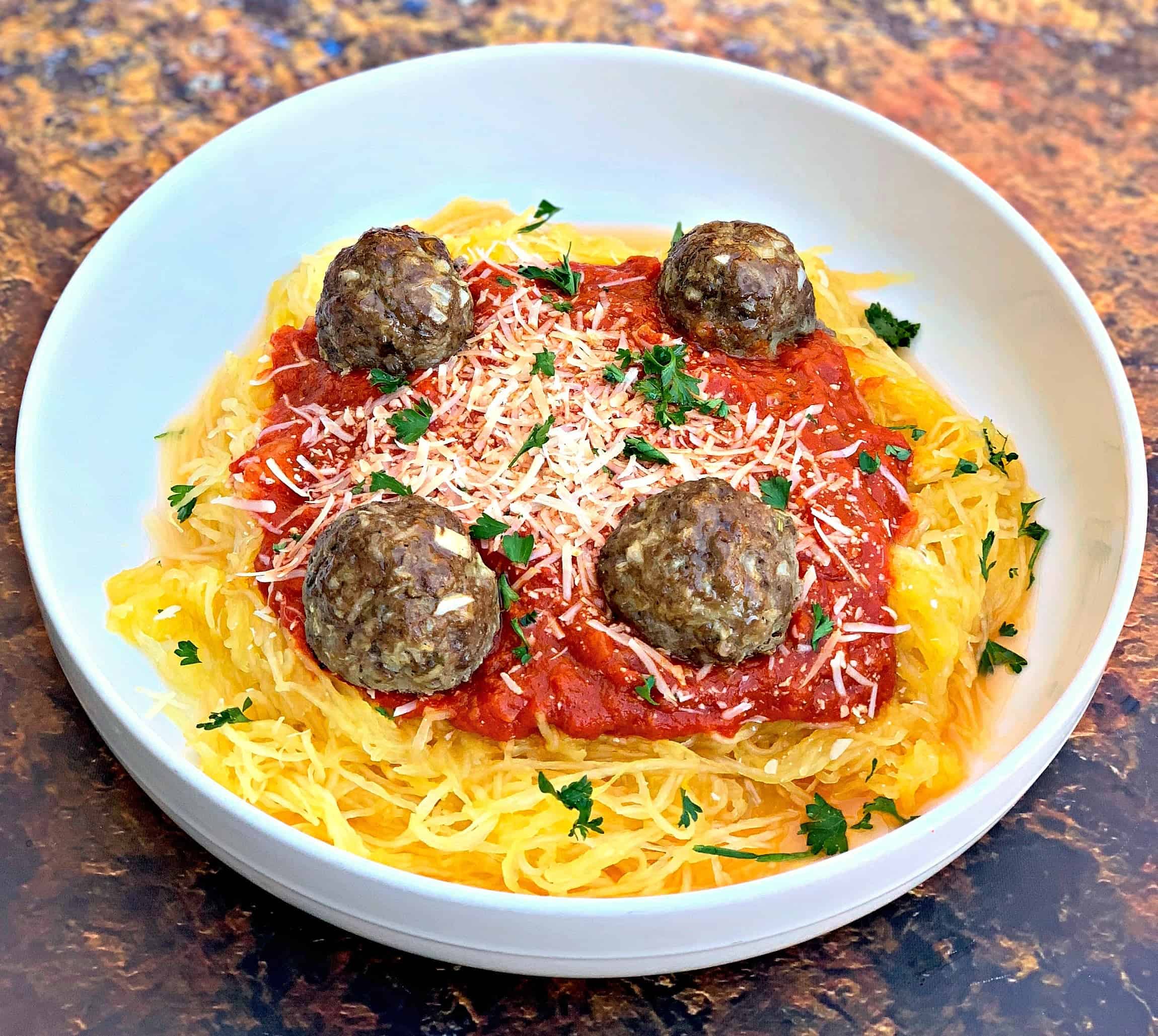 spaghetti squash marinara in a white bowl