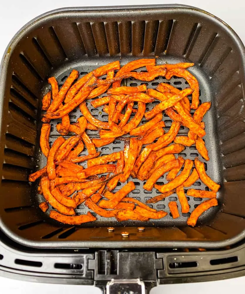 cooked sweet potato fries in an air fryer