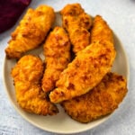 air fryer fried chicken tenders on a white plate