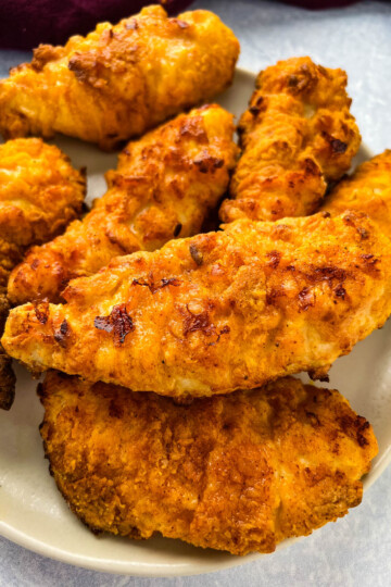 air fryer fried chicken tenders on a white plate