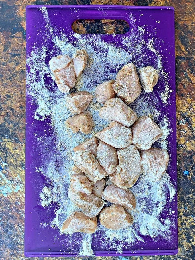 sliced chicken breasts on a cutting board