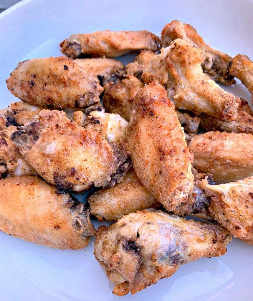 fried air fryer chicken wings in a white bowl