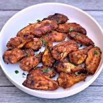 air fryer honey bbq chicken wings in a white bowl