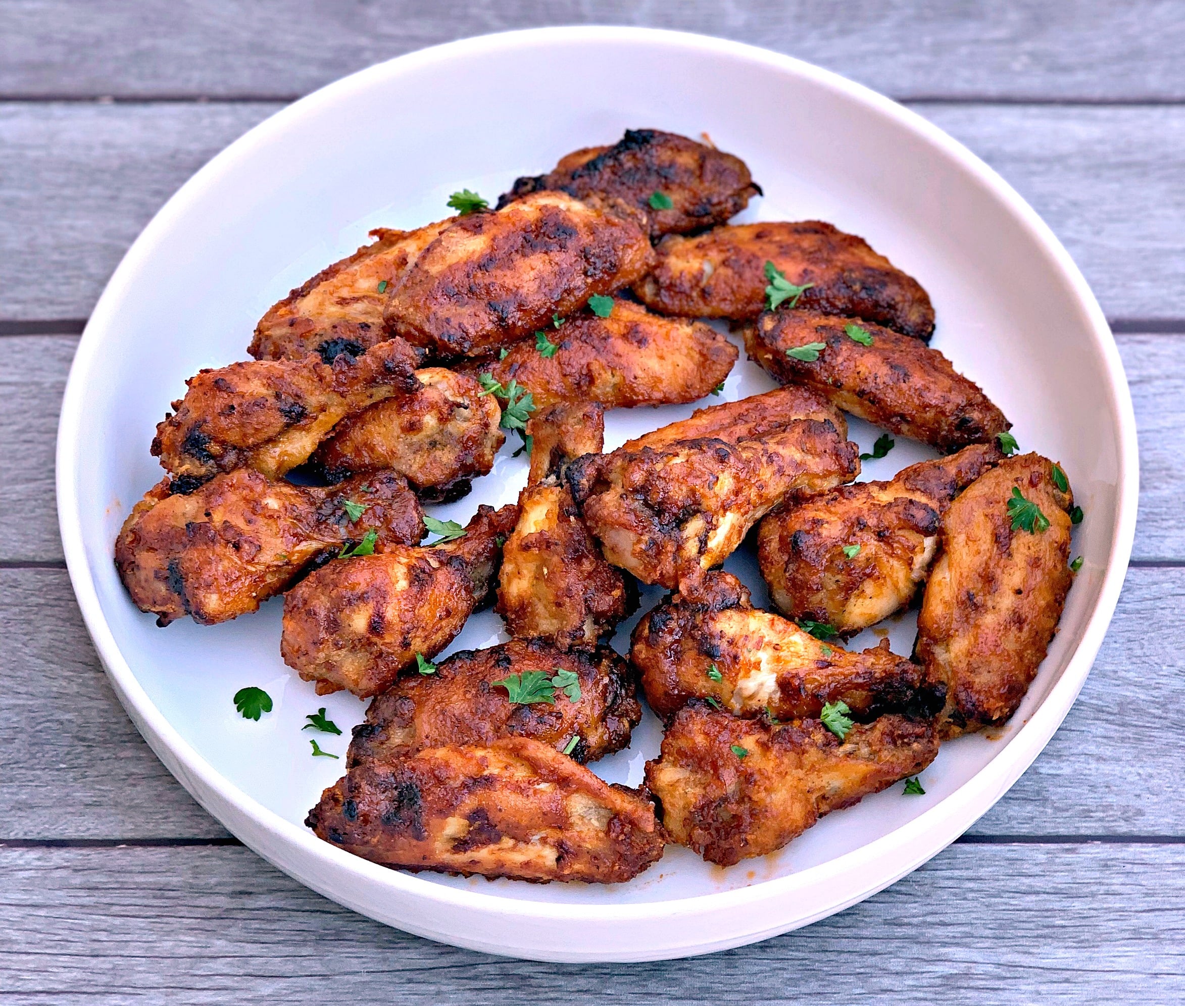 air fryer honey bbq chicken wings in a white bowl