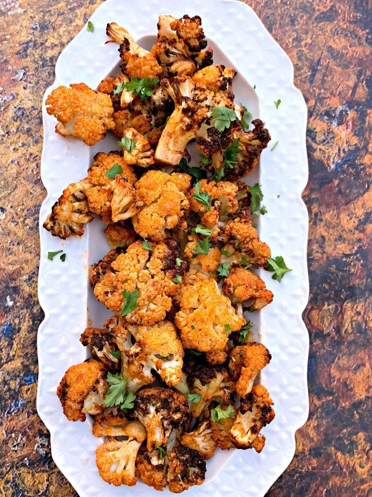 keto buffalo cauliflower wings on a white plate