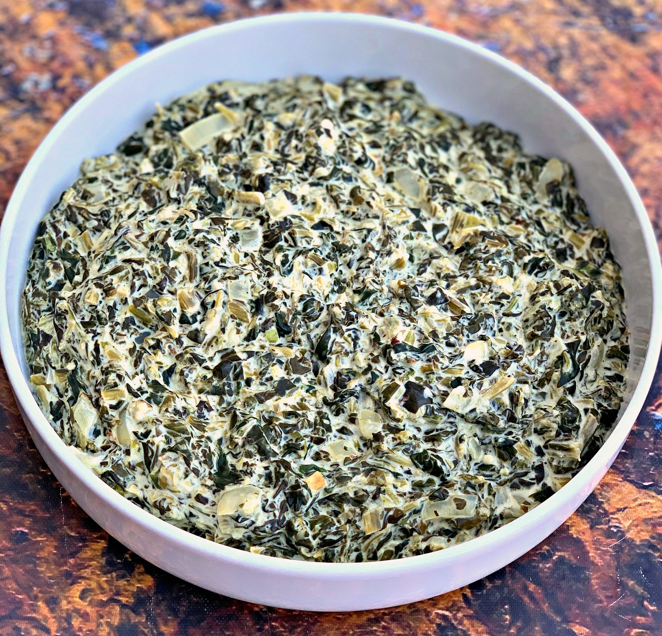 keto low carb creamed spinach in a white bowl
