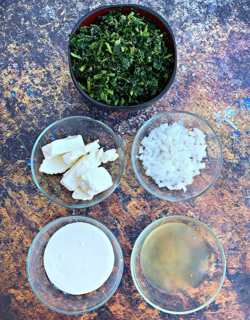 ingredients for keto low carb creamed spinach in a white bowl