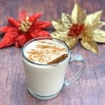keto low carb egg nog in a mug with holiday decor in the background