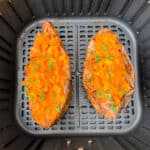air fryer loaded sweet potatoes with butter and cinnamon on a white plate