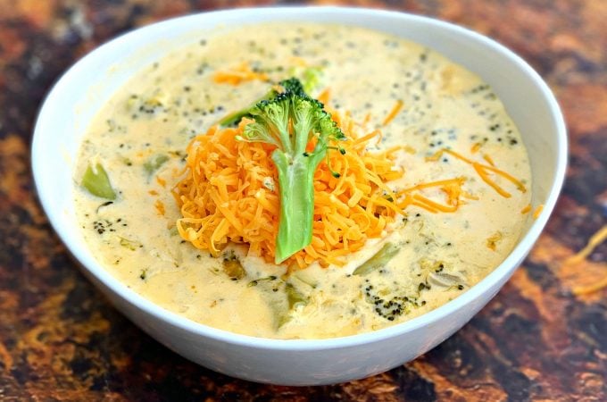 keto low carb instant pot broccoli cheddar soup in a white bowl