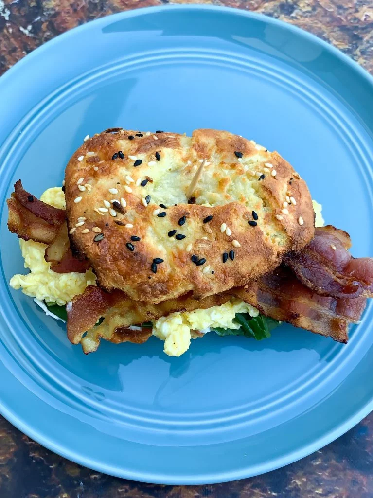 cooked keto fathead bagel sandwich with bacon and eggs
