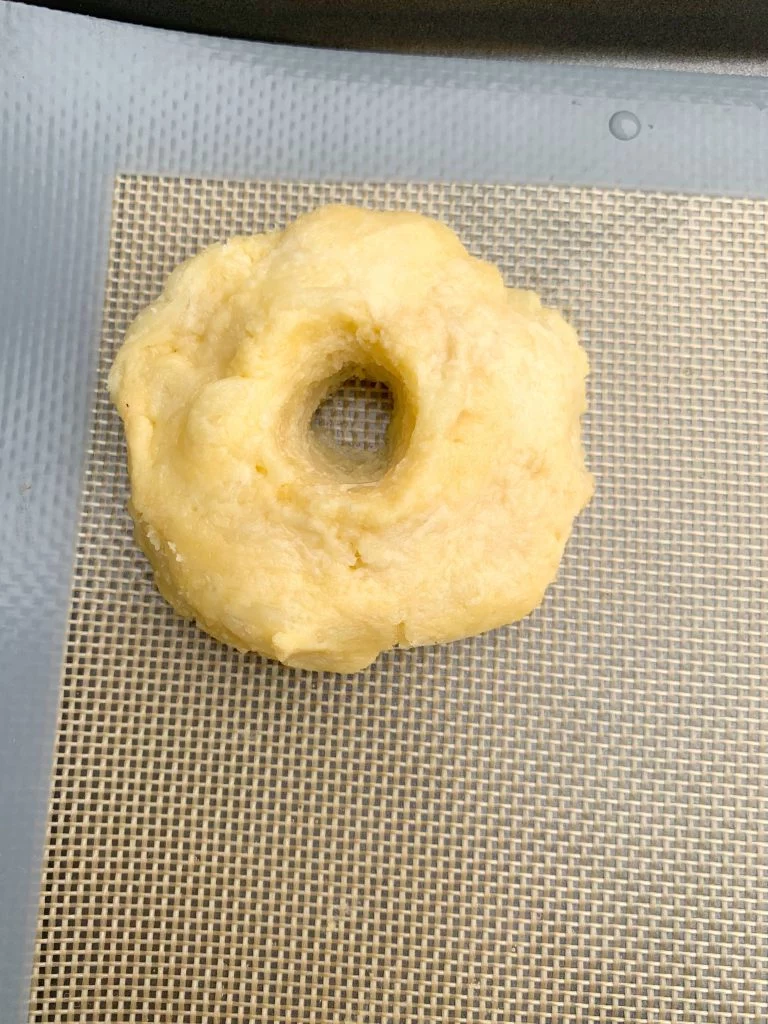 keto fathead bagel dough on a baking mat