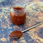 keto low carb bbq sauce in a jar and with a spoon of sauce