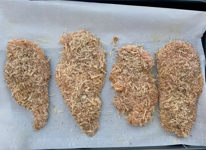 keto parmesan chicken on parchment paper