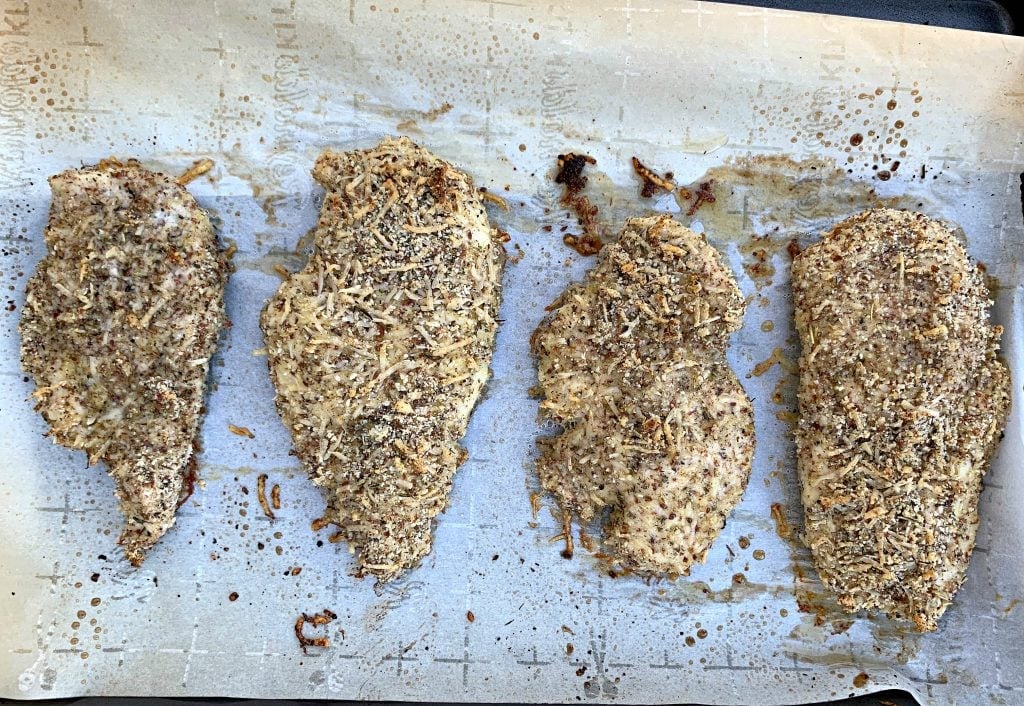 keto parmesan chicken on parchment paper